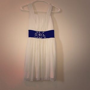 White and black dress with jewels.